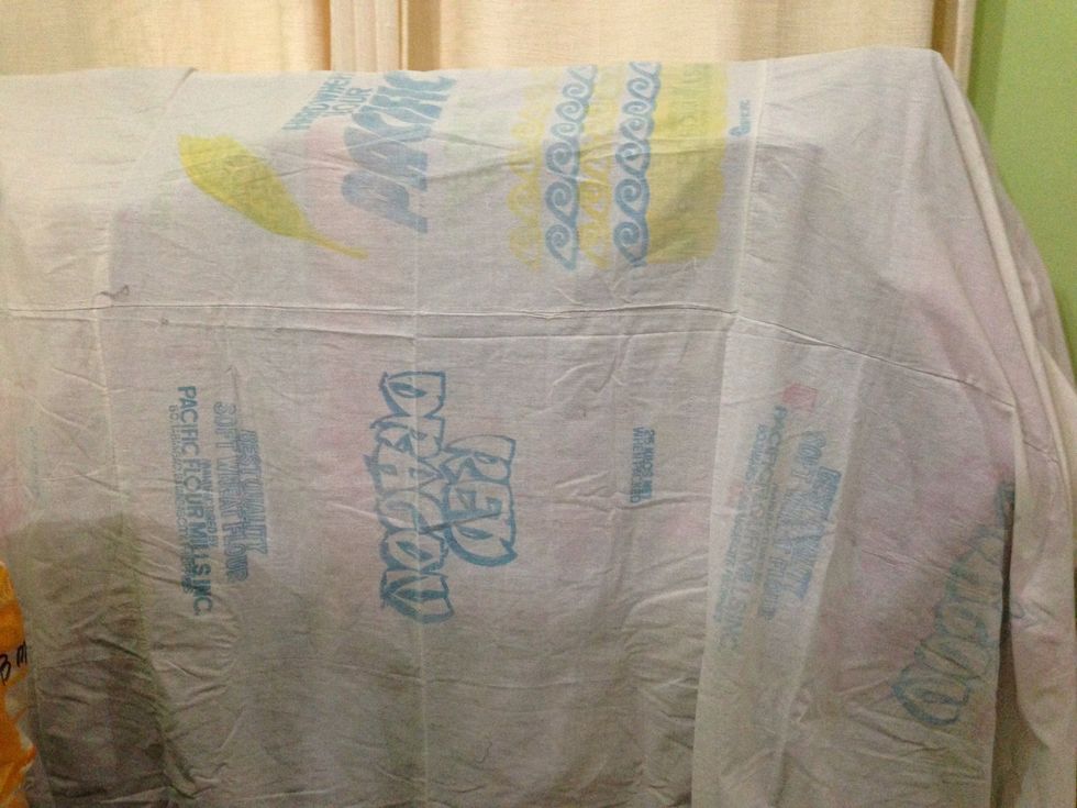 Throw the canvass or any fabric over the clothes rack.