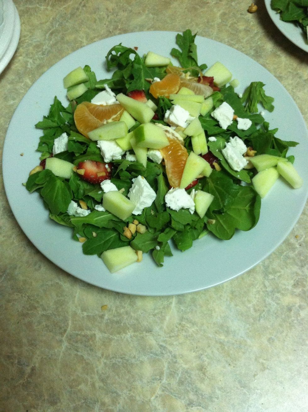 Throw the nuts, fruit, and cheese onto the arugula. My roomie thought some nectarines would be good.  Why not?  You can add whatever fruit you'd like, have fun with it.