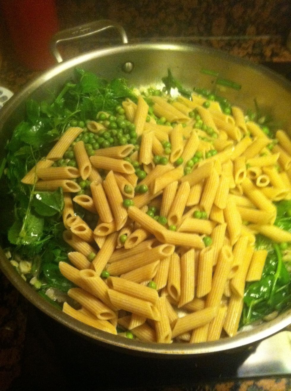 Throw the pasta and peas into the saut\u00e9 pan and cook in the remaining liquid until it's mostly absorbed and the pasta is cooked to your liking. I like mine al dente.