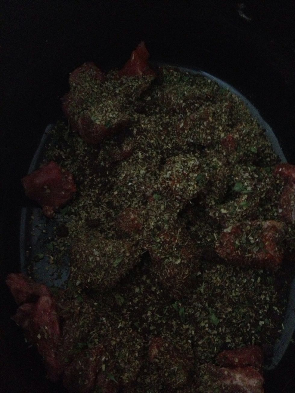 Throw your beef into the pot and cover liberally with your herbs tomato pur\u00e9e and beef stock cube . Yes it should look like the bottom of a birdcage !