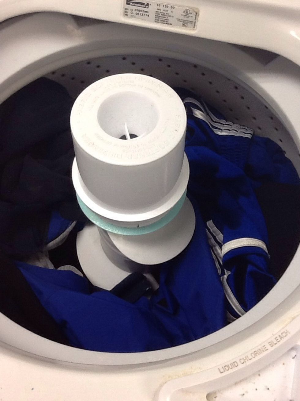 Throw your clothes in and the tube is for fabric softener.