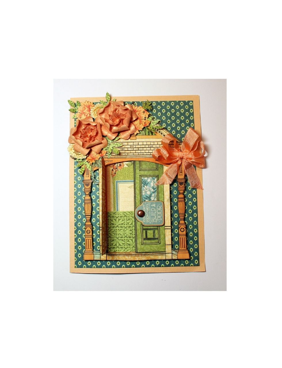 Tie a bow from seam binding & attach as shown. Fasten a small tag to a door with a brad to hold the doors closed.  Position the tag so that it  rotates up but still allows the door to open.