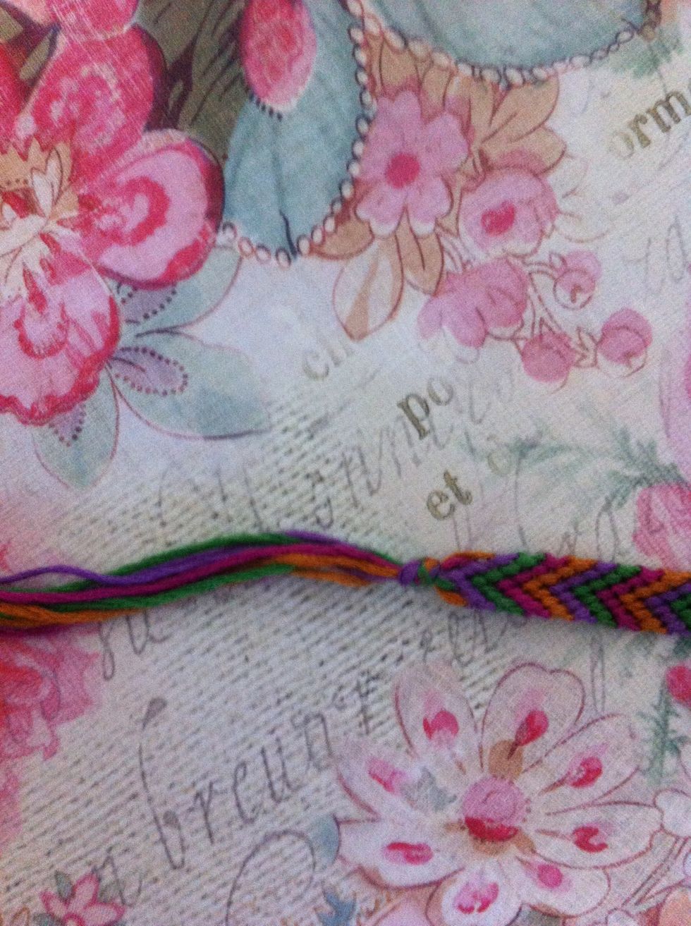 Tie a knot at the beginning and ending of your bracelet. Let it string at the ends stay the same. Tie both ends together on your wrist.