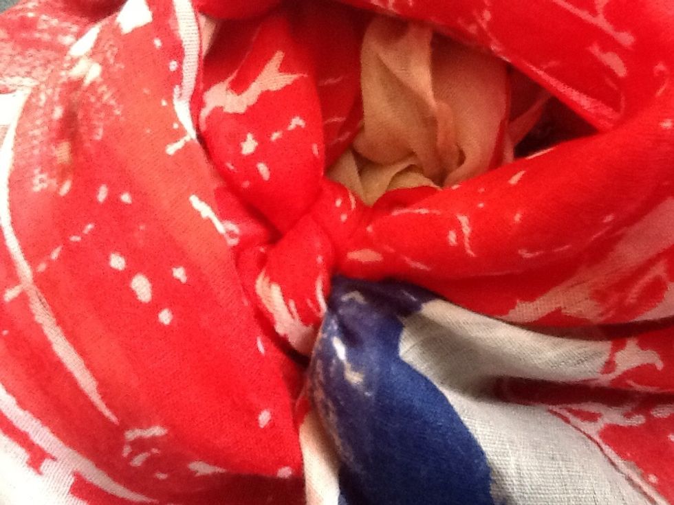 Tie a knot, but make sure you tie it under the first knot.