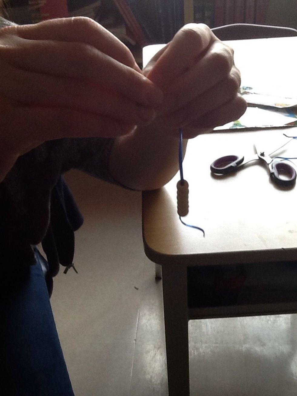 Tie a knot in the opposite end.