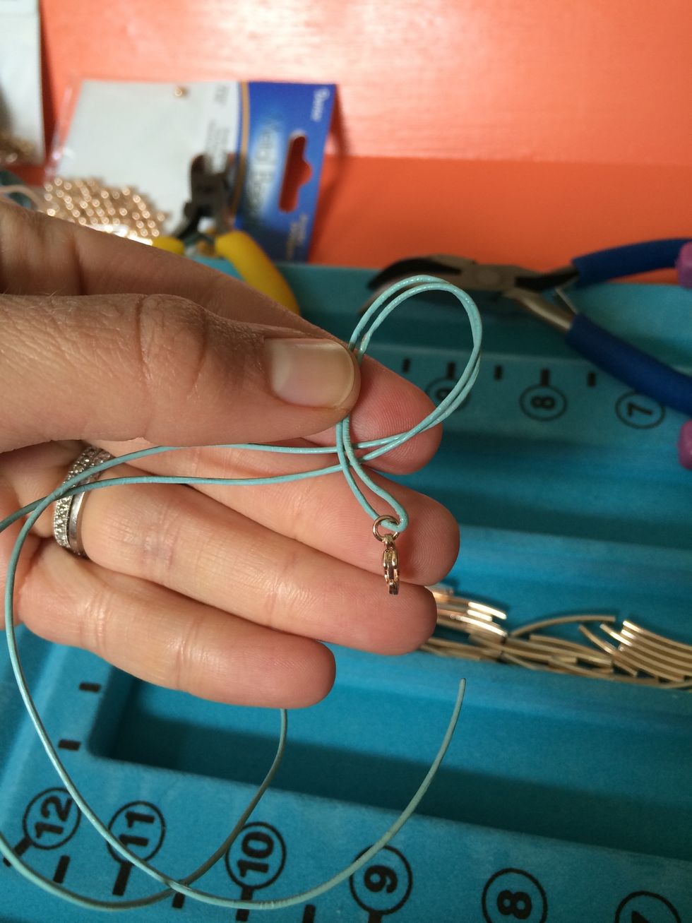 Tie a knot to secure. Starts like so...