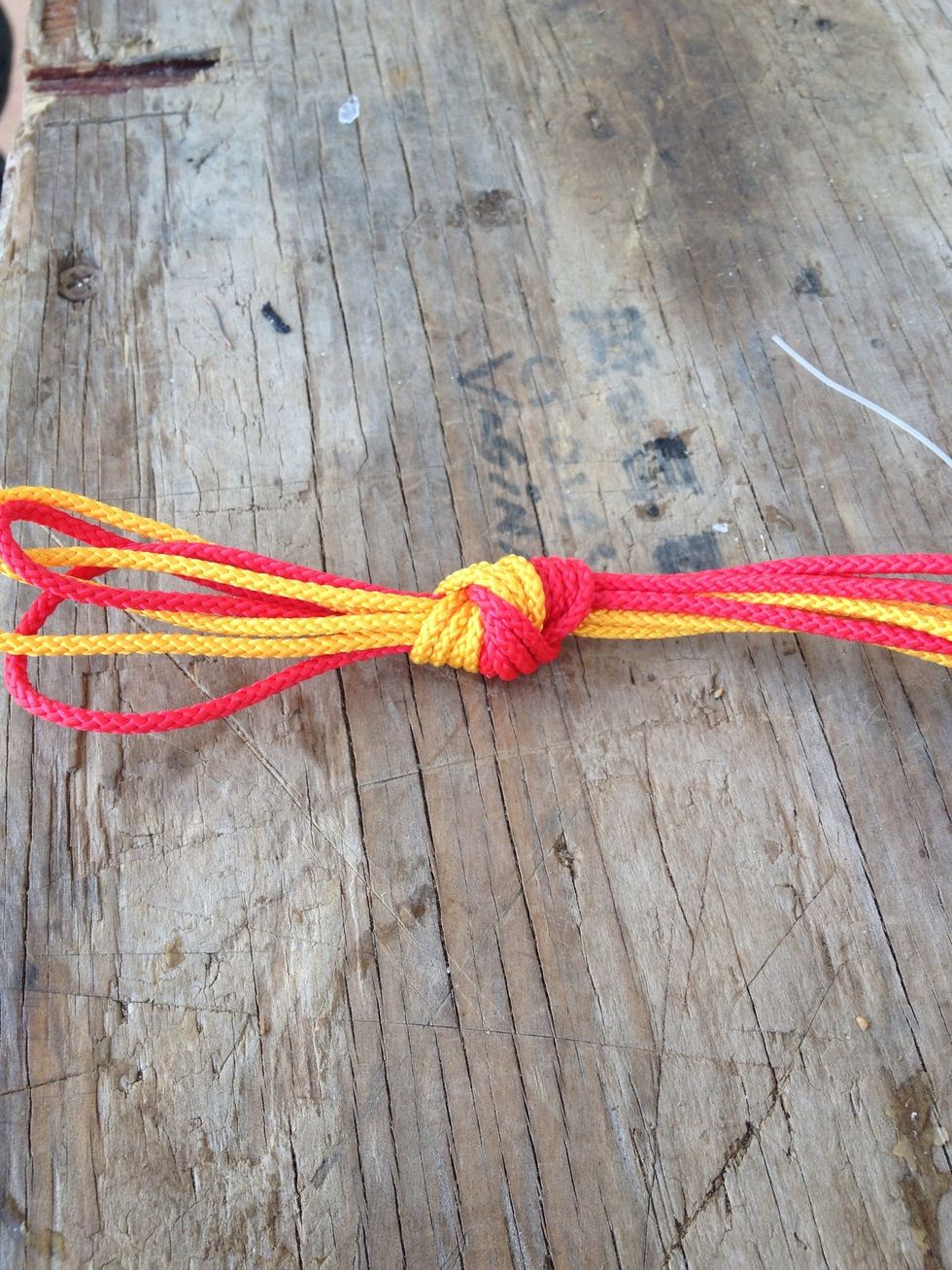 Tie a overhand knot. This may take awhile because it will look nicer if you get all the line in even with each other. Some may not be lined up right.