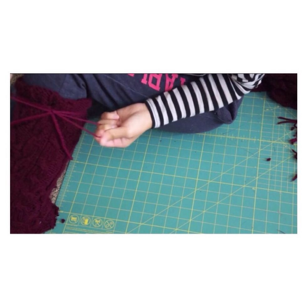 Tie a piece of yarn around the top of the boot in a bow for extra glam!