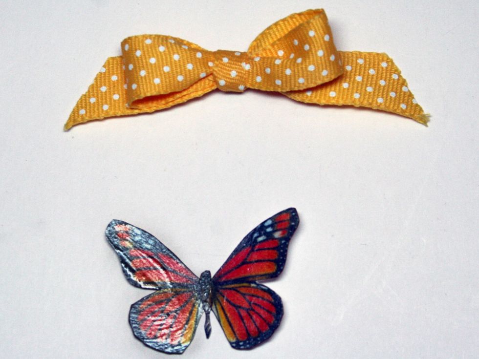 Tie a pretty bow and butterfly. The butterfly I used is from my stash. I coated it with Glossy Accents to give it strength.