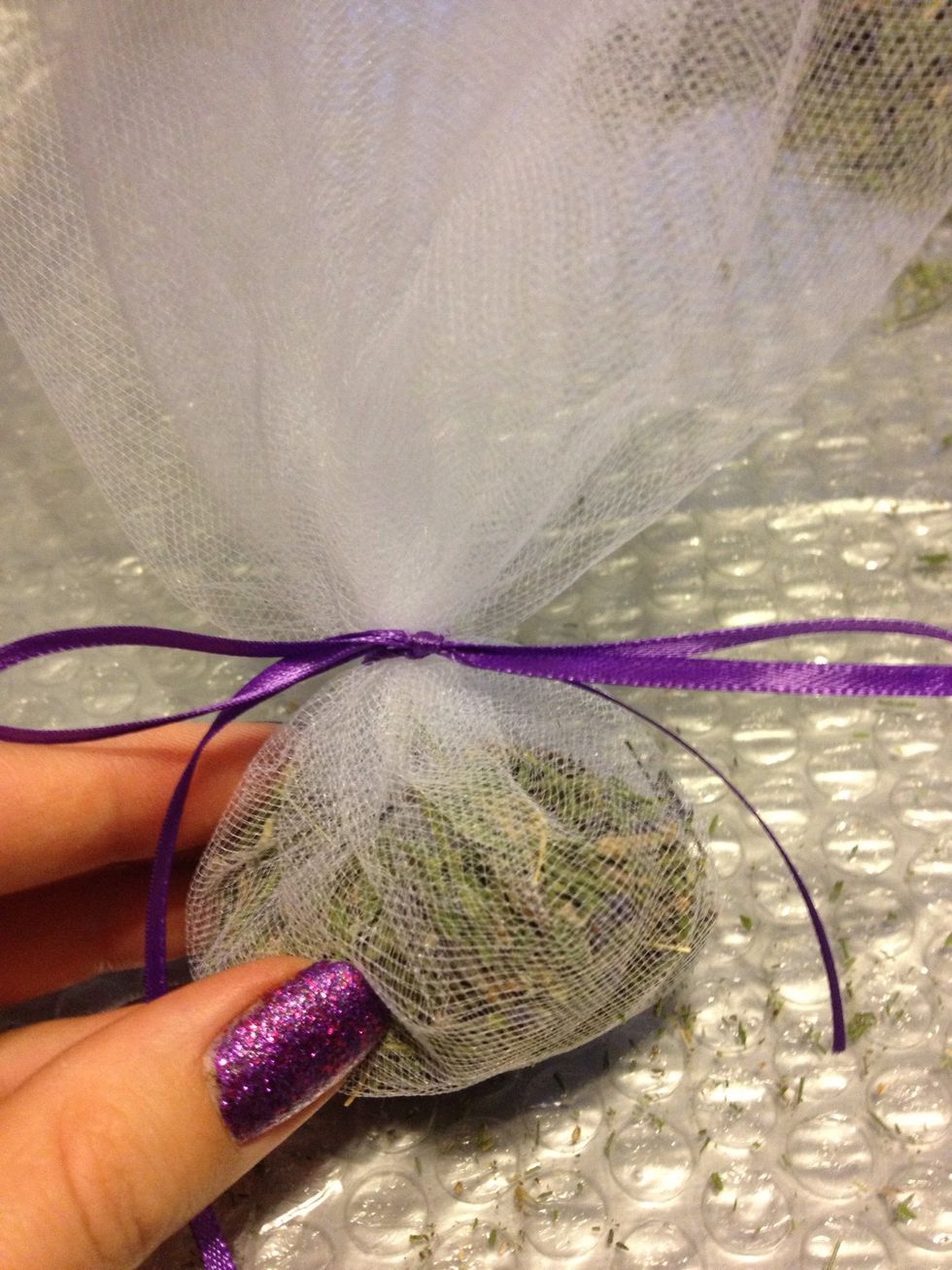 Tie a ribbon around the satchel.