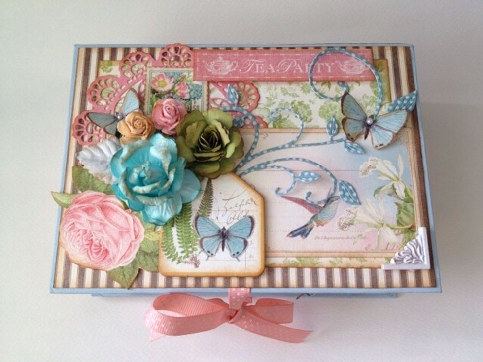 Tie a ribbon before you stick the paper down.