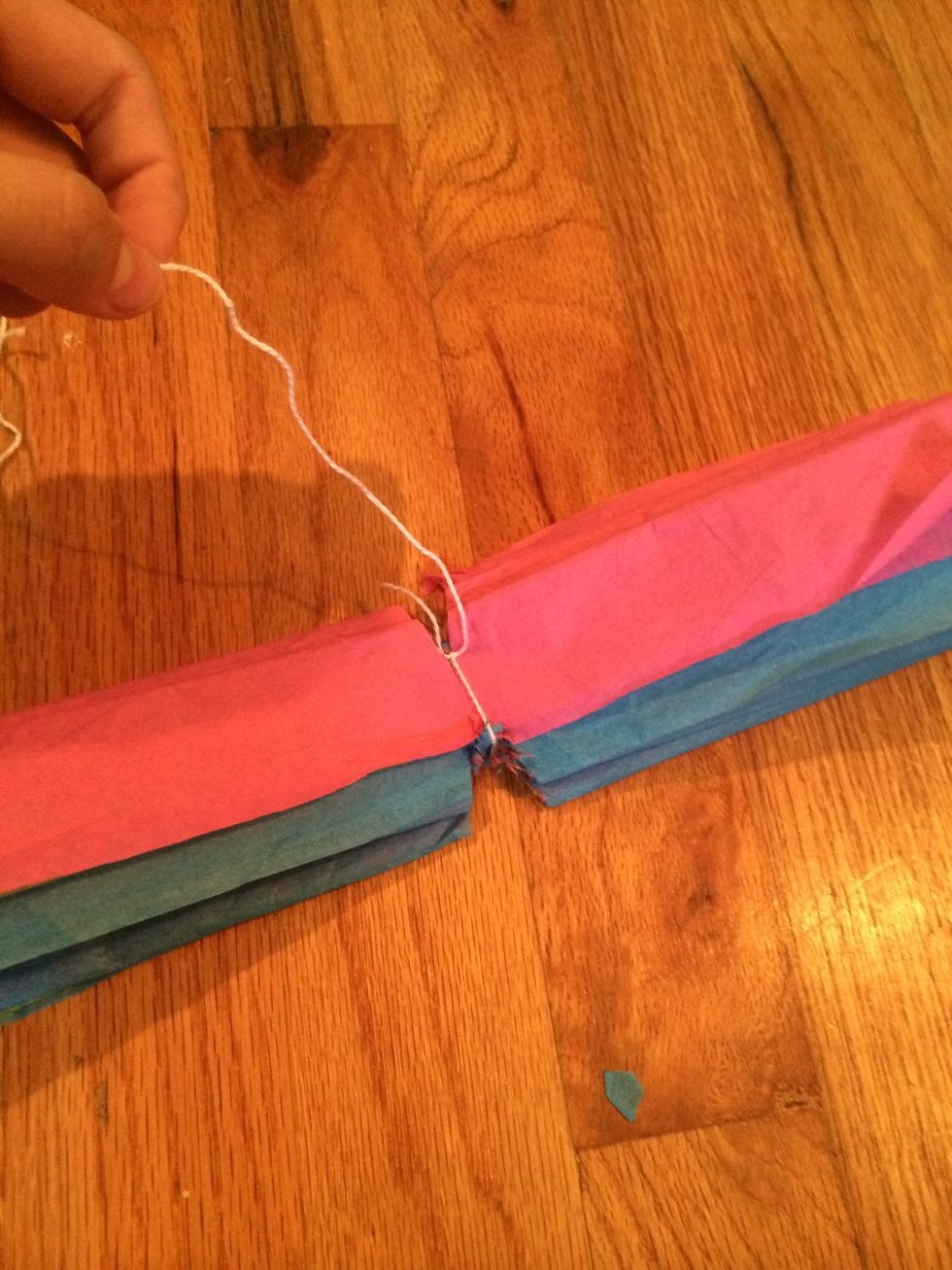 Tie a string around the center