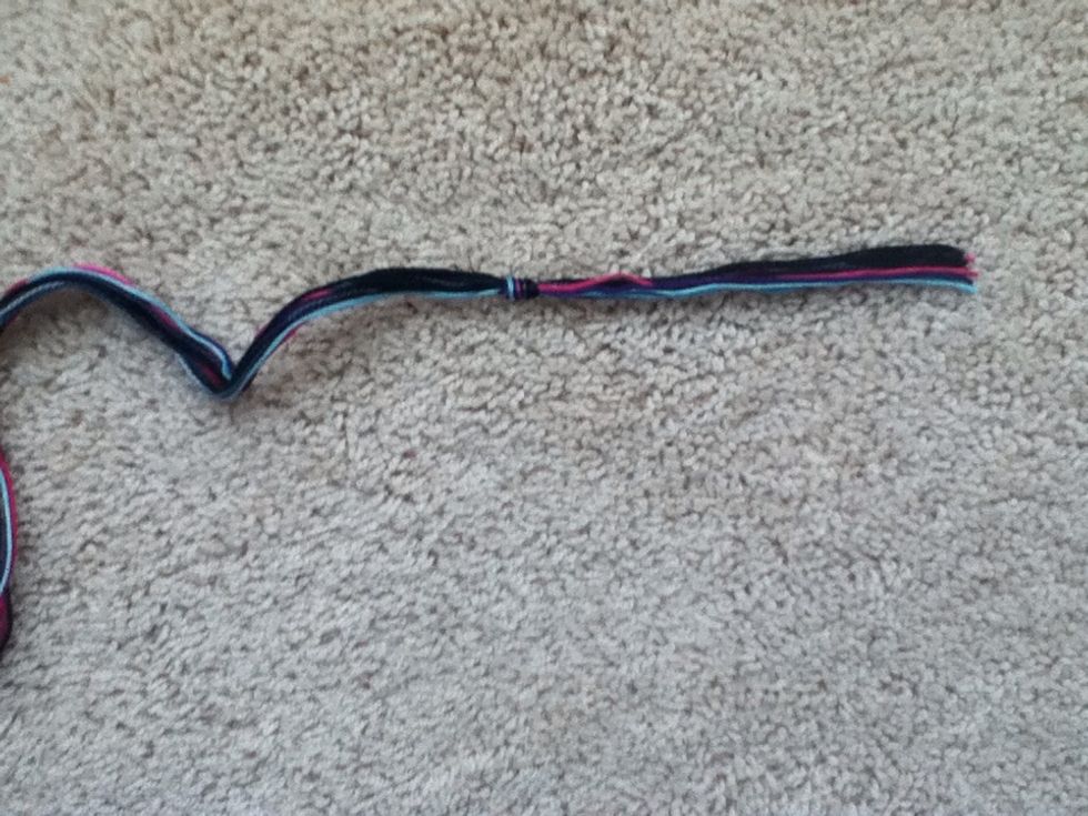 Tie a temporary knot about 3 inches from the top.