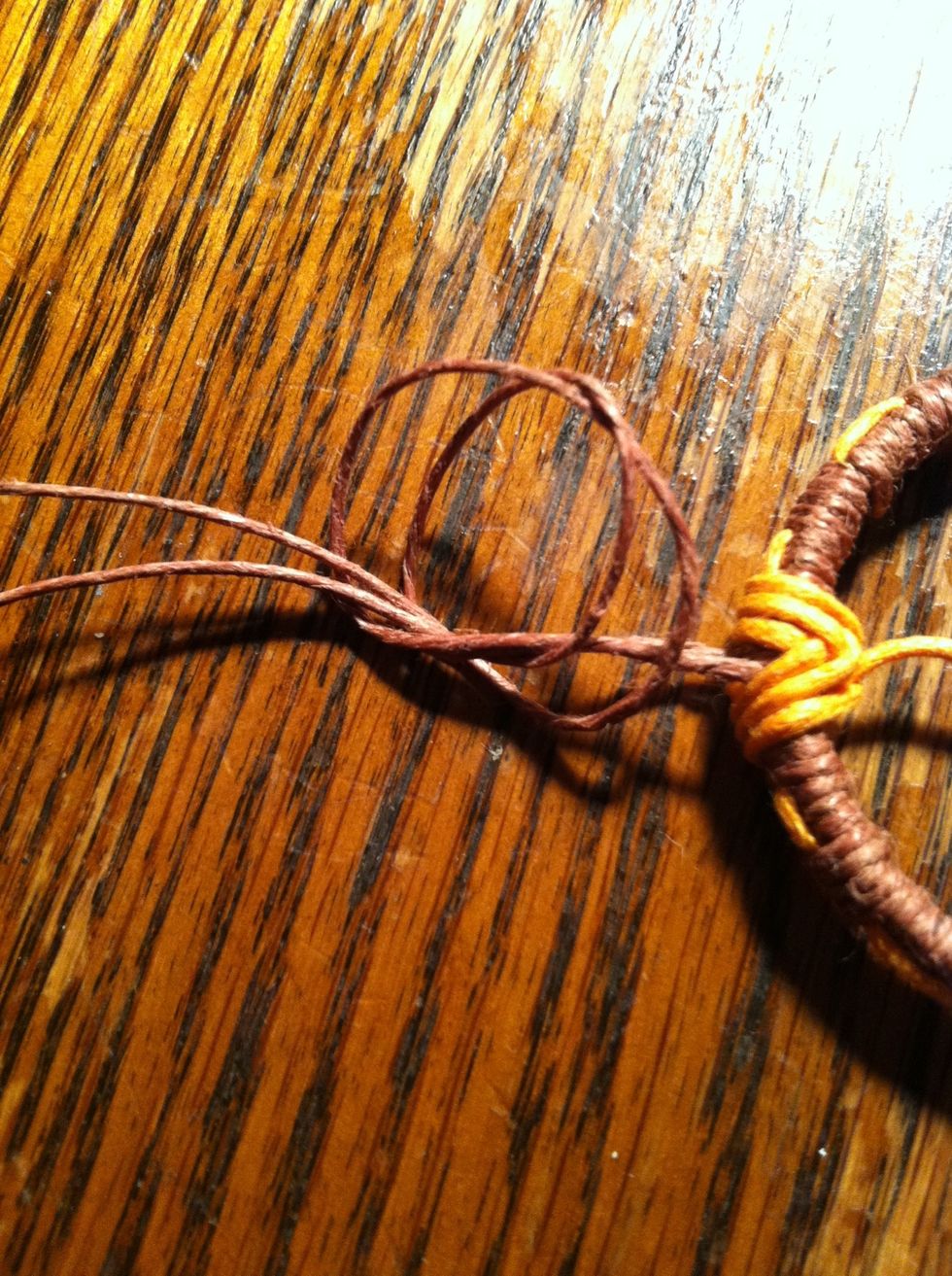 Tie an overhand knot and tighten as close to ring as possible. The easiest way to do this is slowly...