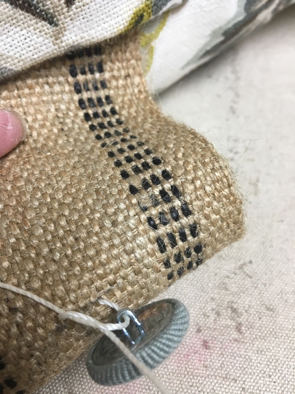 Tie each button onto the webbing at your marks. We used tufting twine but dental floss works great.