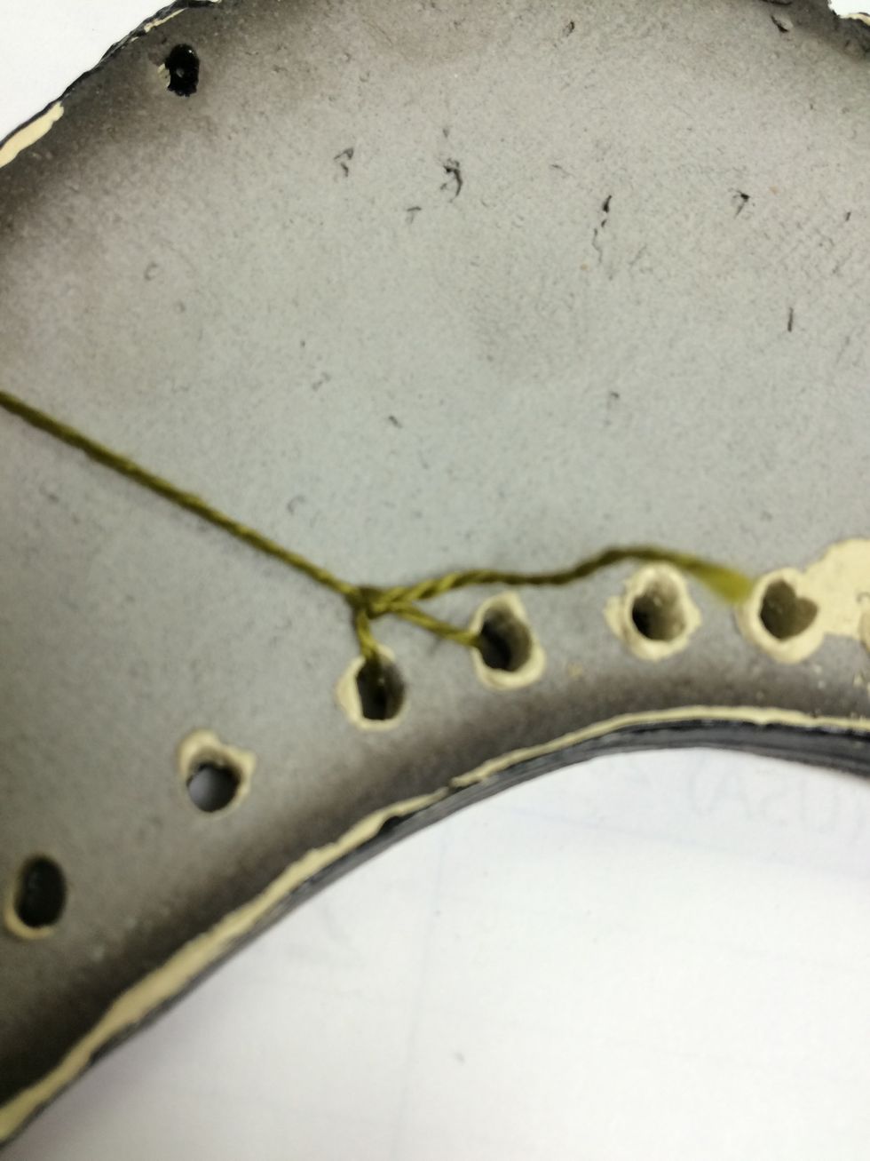 Tie it in a knot at the back.