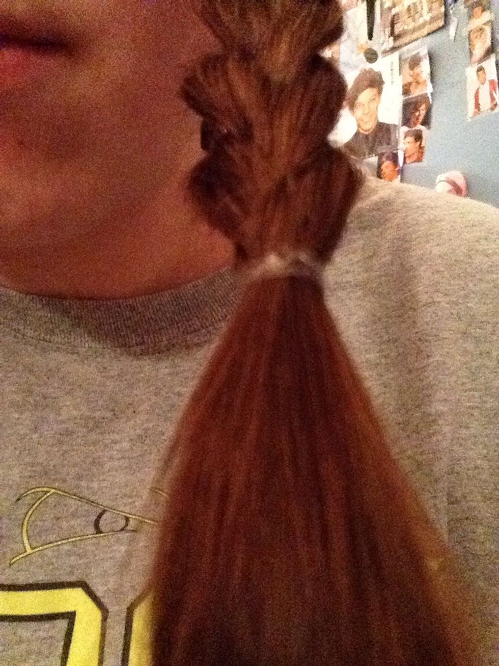 Tie it off with the small elastic bands and repeat to the other sections