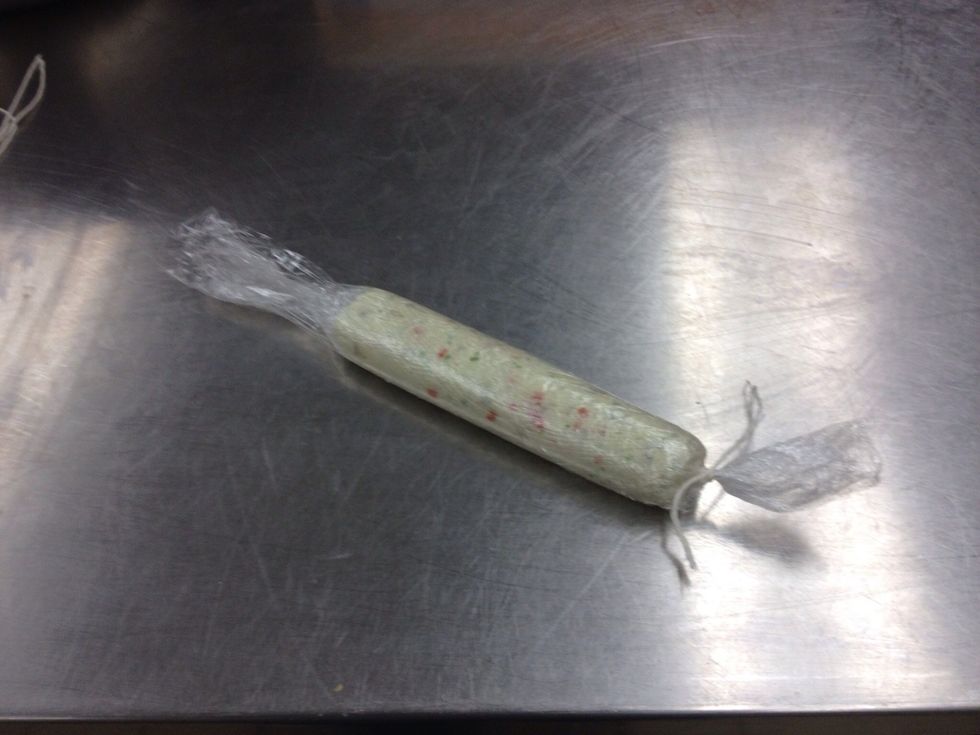 Tie off one end of cylinder.