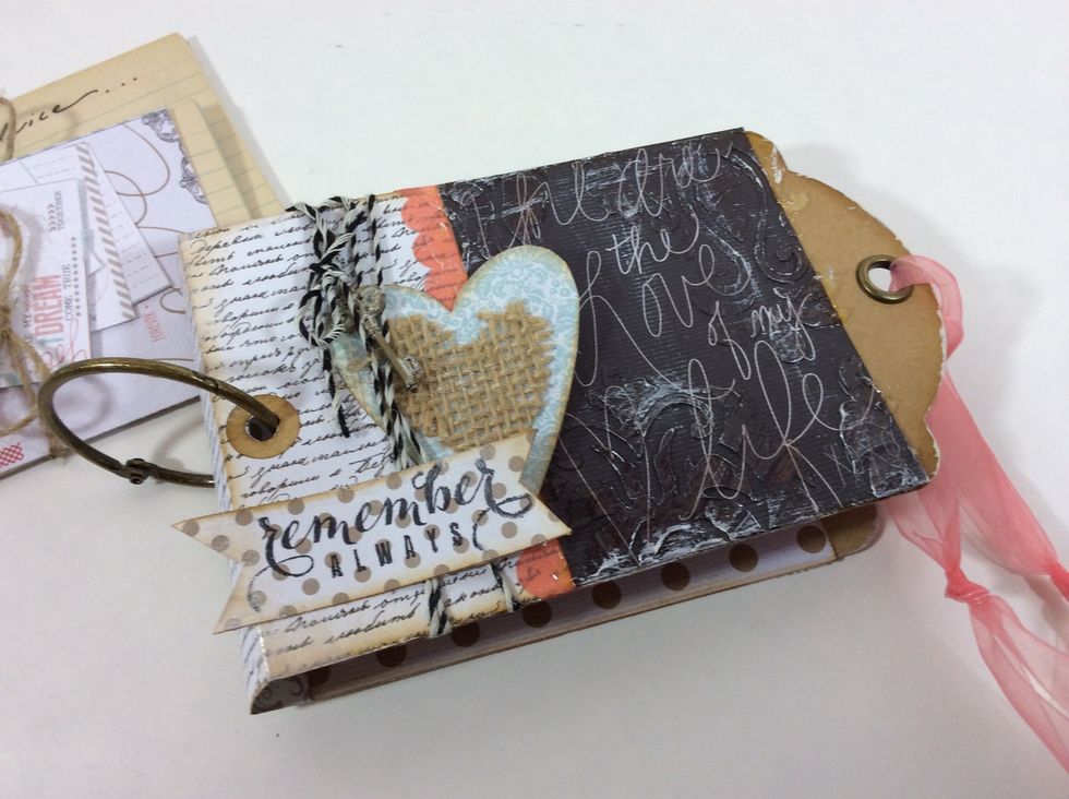 Tie ribbon through tag eyelets.
