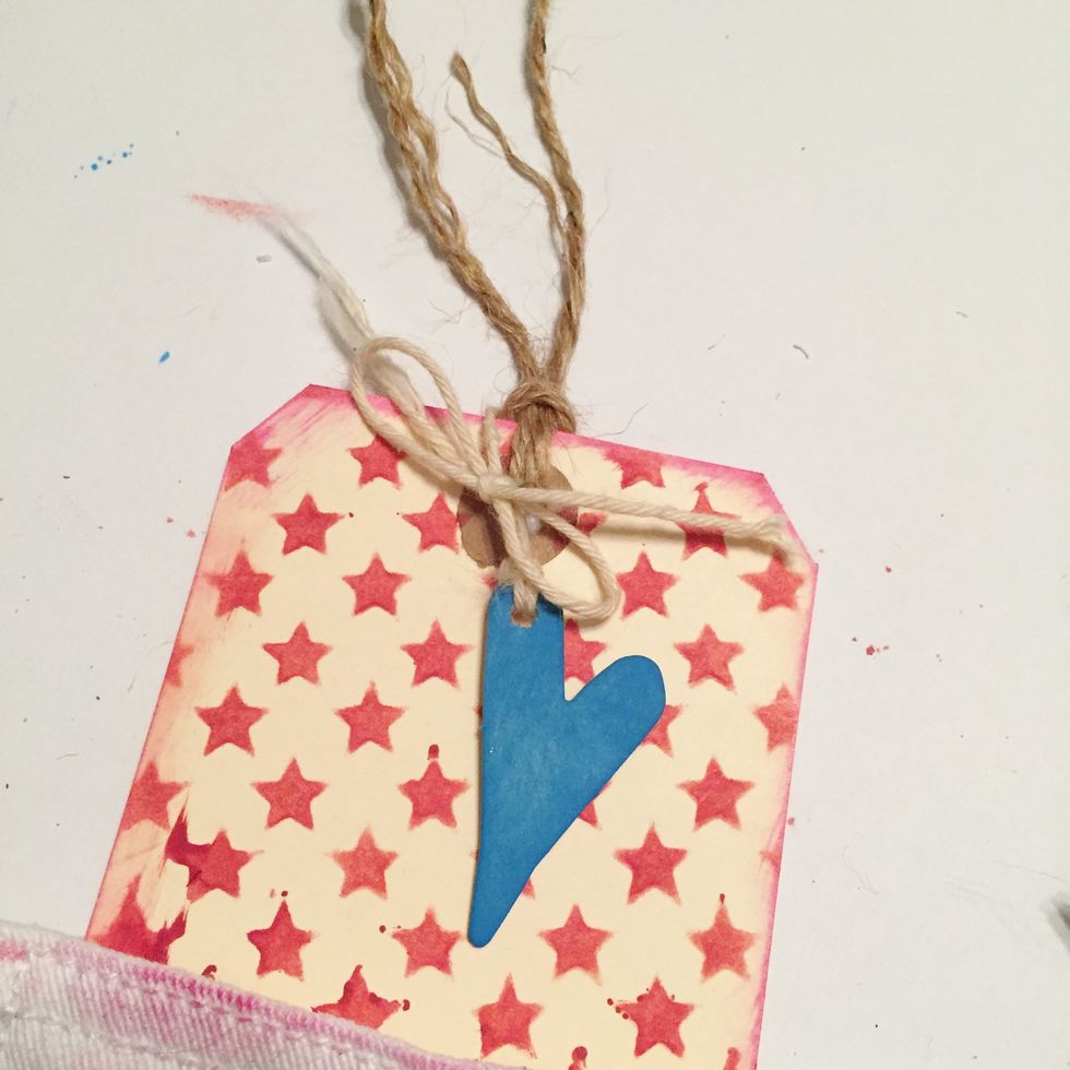 tie tag with jute. punch hole in heart and hang from tag with twine.