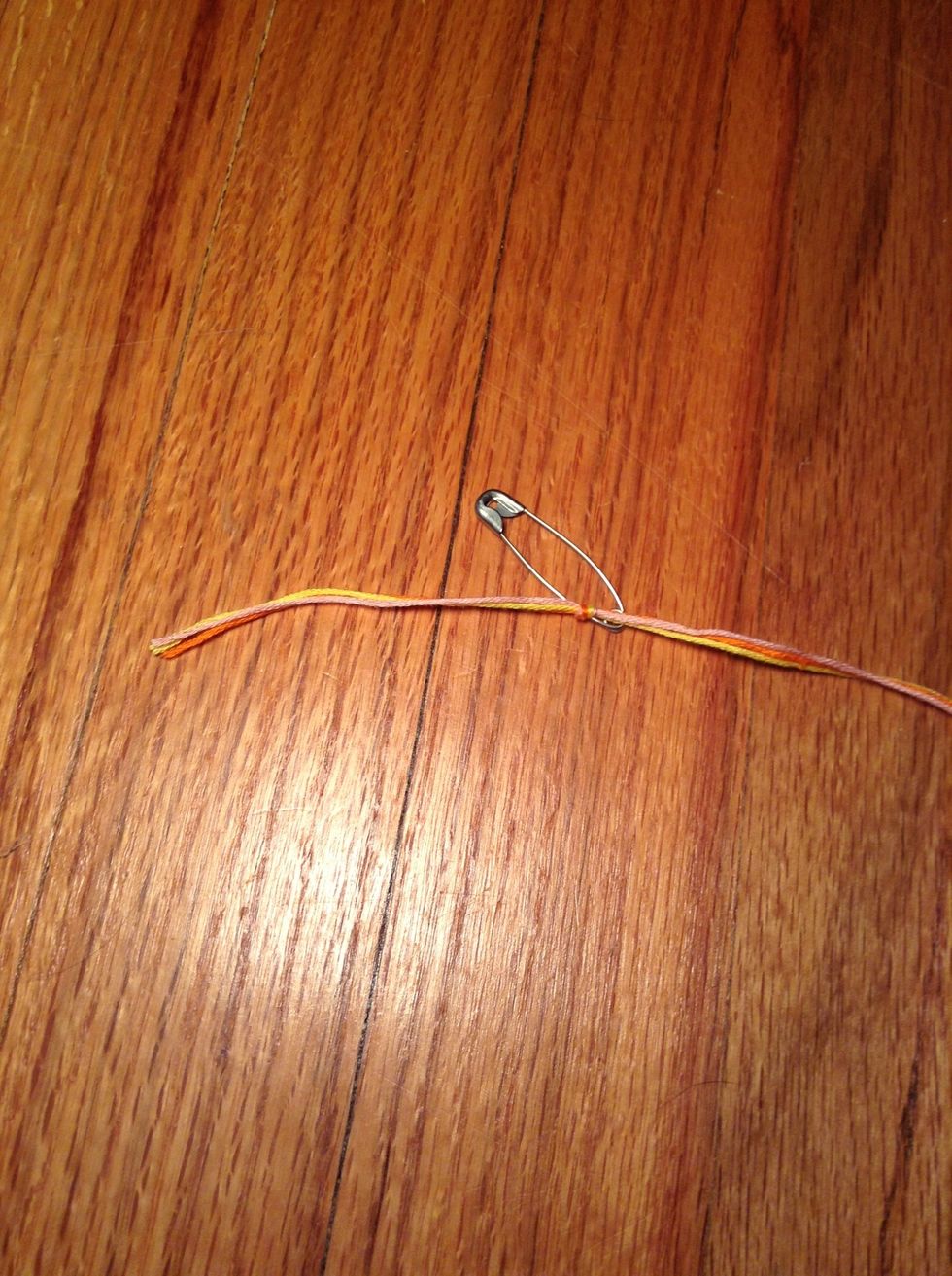 Tie the end of your piece to the safety pin