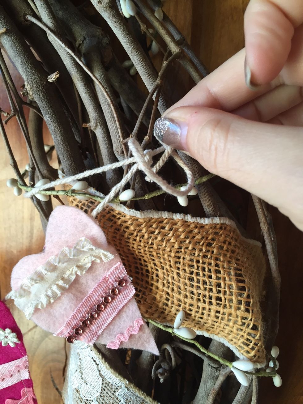 Tie the extra side string around your wreath. Easy to tie on and take off and easy store away with your other holiday decorations.