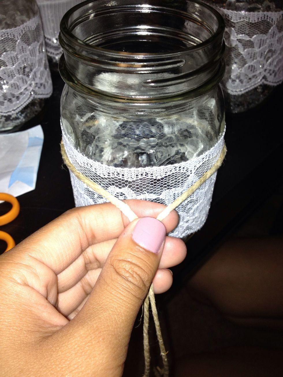Tie the hemp twine around the jar