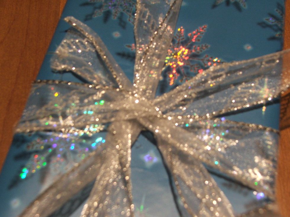 Tie the horizontal Ribbon over the vertical Ribbon.