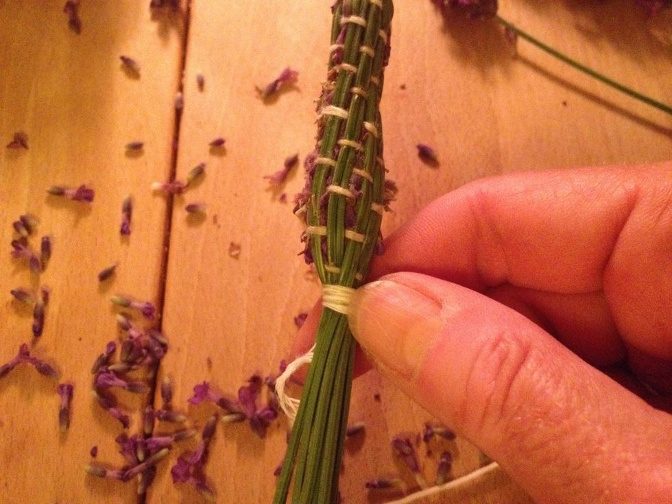 Tie the string round the stems when you have covered the flower heads. Trim the stems.