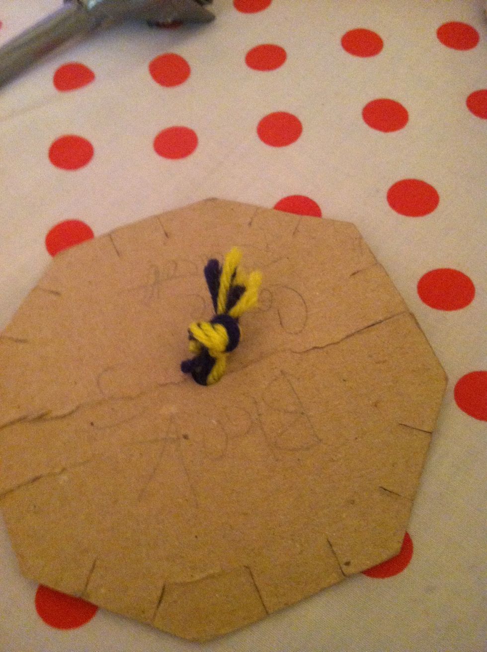 Tie the string so it won't go through the whole
