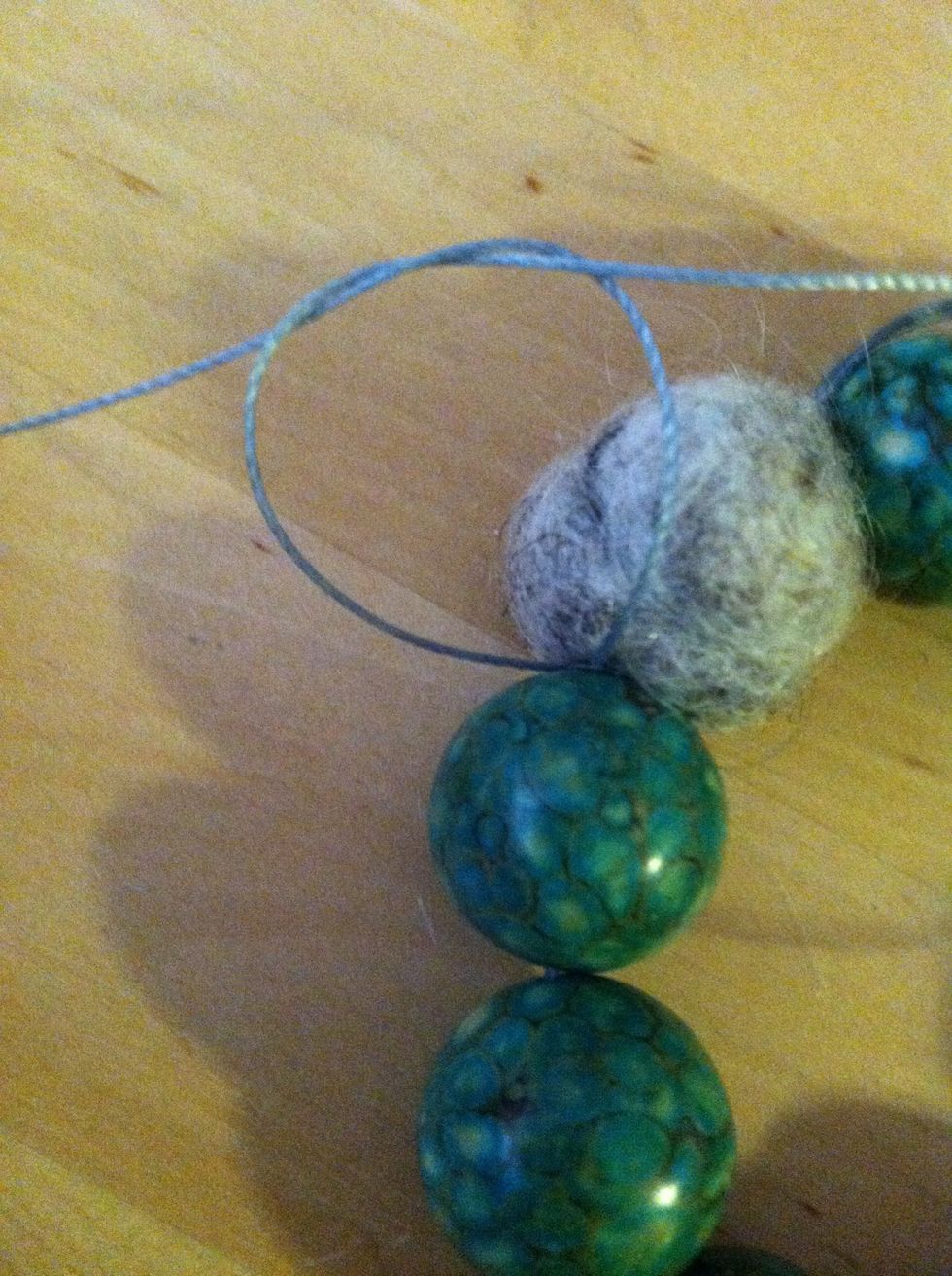 Tie the tails in an overhand knot.