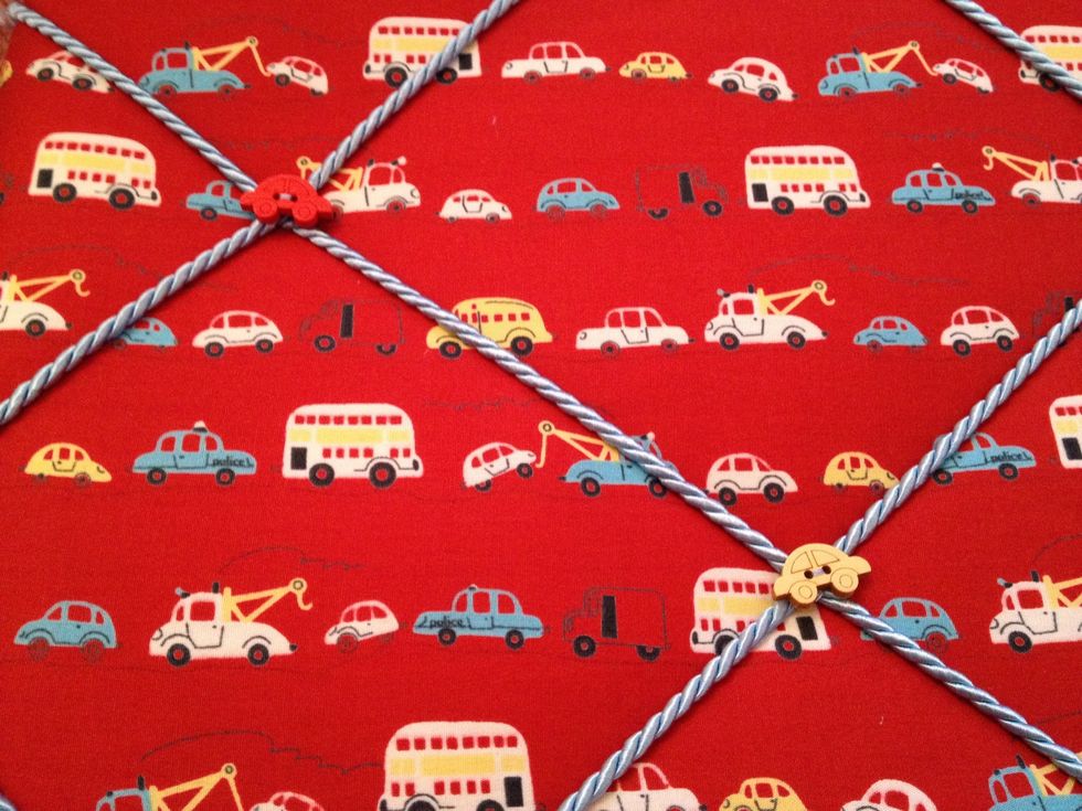 Tie the thread round the cord to hide staples, make sure it is secure.