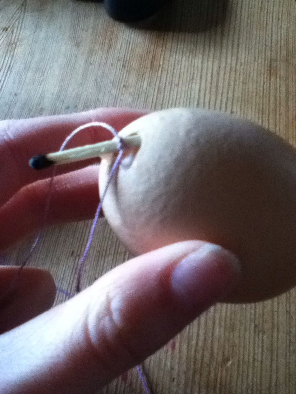 Tie thread around match and pop into top of egg