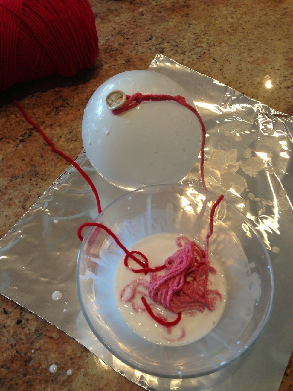 Tie yarn on to balloon
