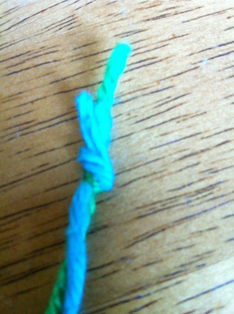 Tie your two (2ft Yarn Pieces) together.*Sorry for the blur!*