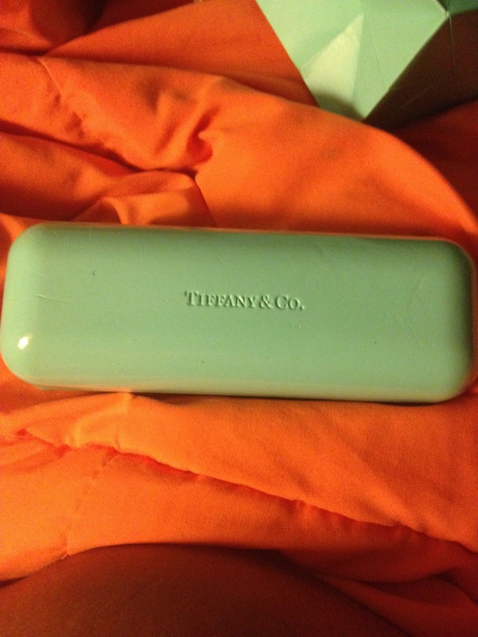 Tiffany eyeglass case. A little beat up because I've had it for a year or so. But the letters are made into the case, in fakes you usually the letters printed on.