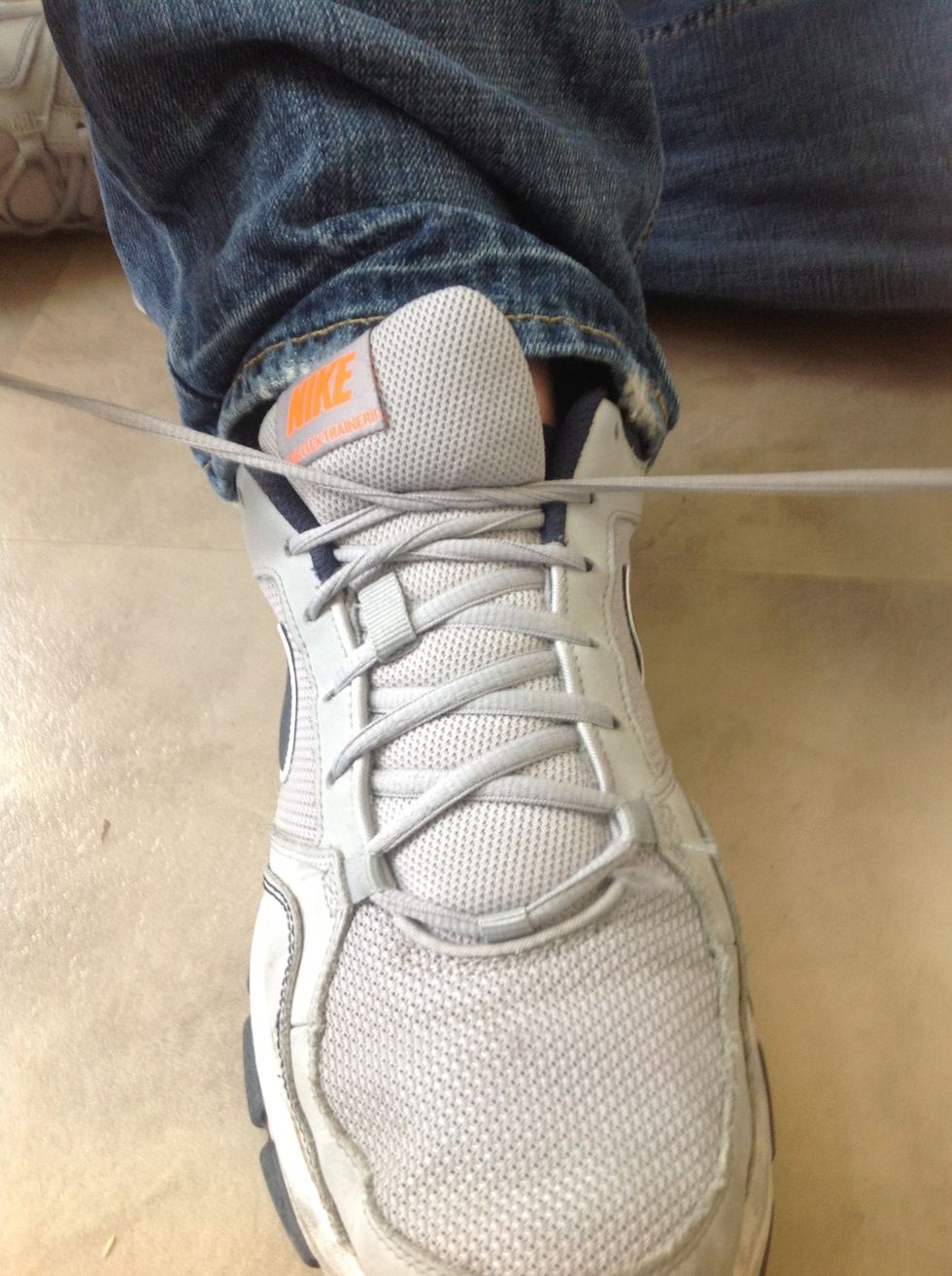 Tighten the laces by pulling them together.