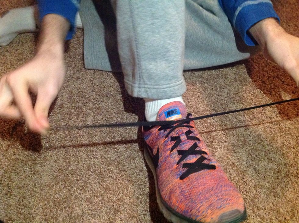 Tighten the laces until your shoe is snug against your foot.