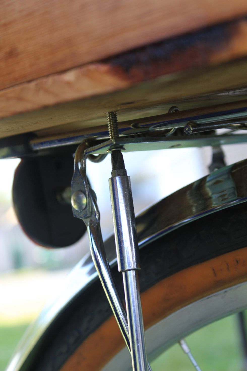 Tighten until all four bolts hold the trunk securely to the rack without any movement when tested.