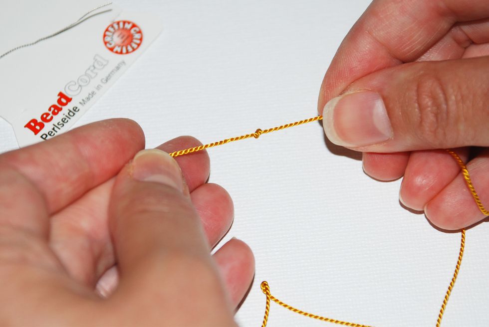 Tighten your knot at the end of the string.