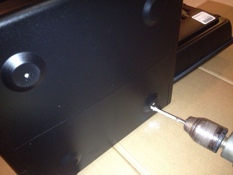 Tilted the safe on its side and easily drilled through.
