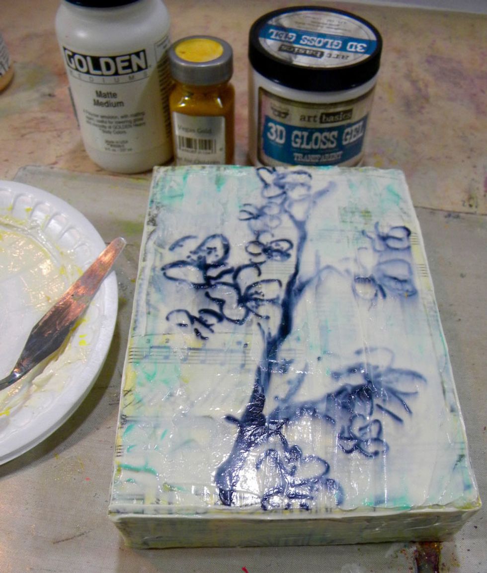 Time for another layer of faux encaustic medium. This time I added less Vegas Gold and no Lemon Tart. Use a palette knife and spread it in a thick layer. It will look opaque, but it drys clear.