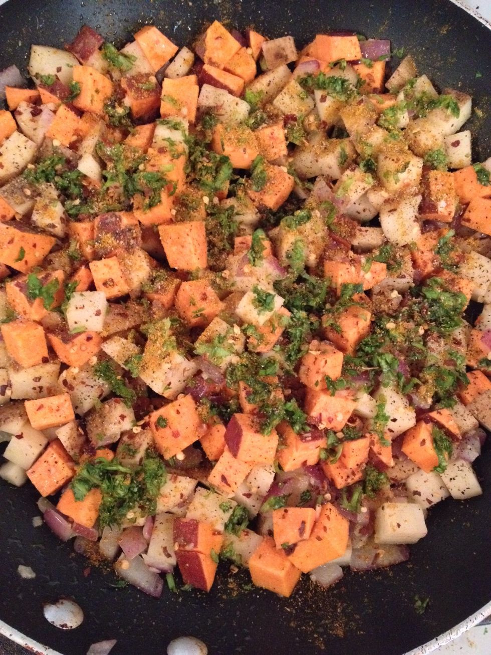 Time to add all your spices! Salt, pepper, curry powder, crushed red pepper...add your minced cilantro and STIR