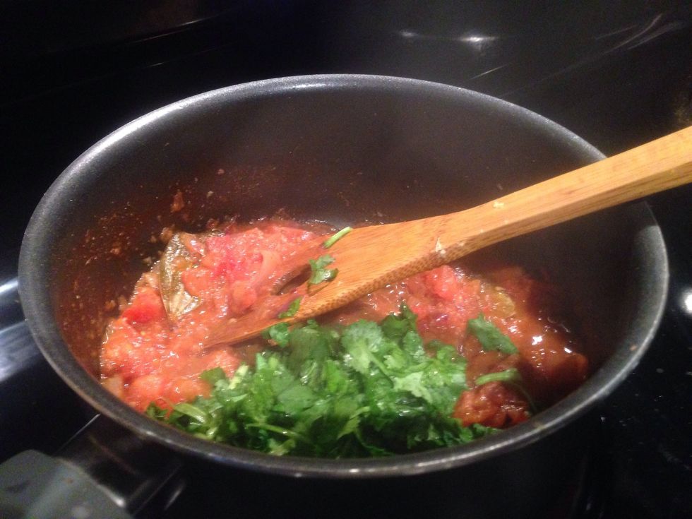 Time to add diced tomato and cook for 5 mins until it gets a bit thick and the gravy starts extracting oil. Now put 1 spoon of coriander powder, half teaspoon of chilli powder and cook for 1-3 mins.