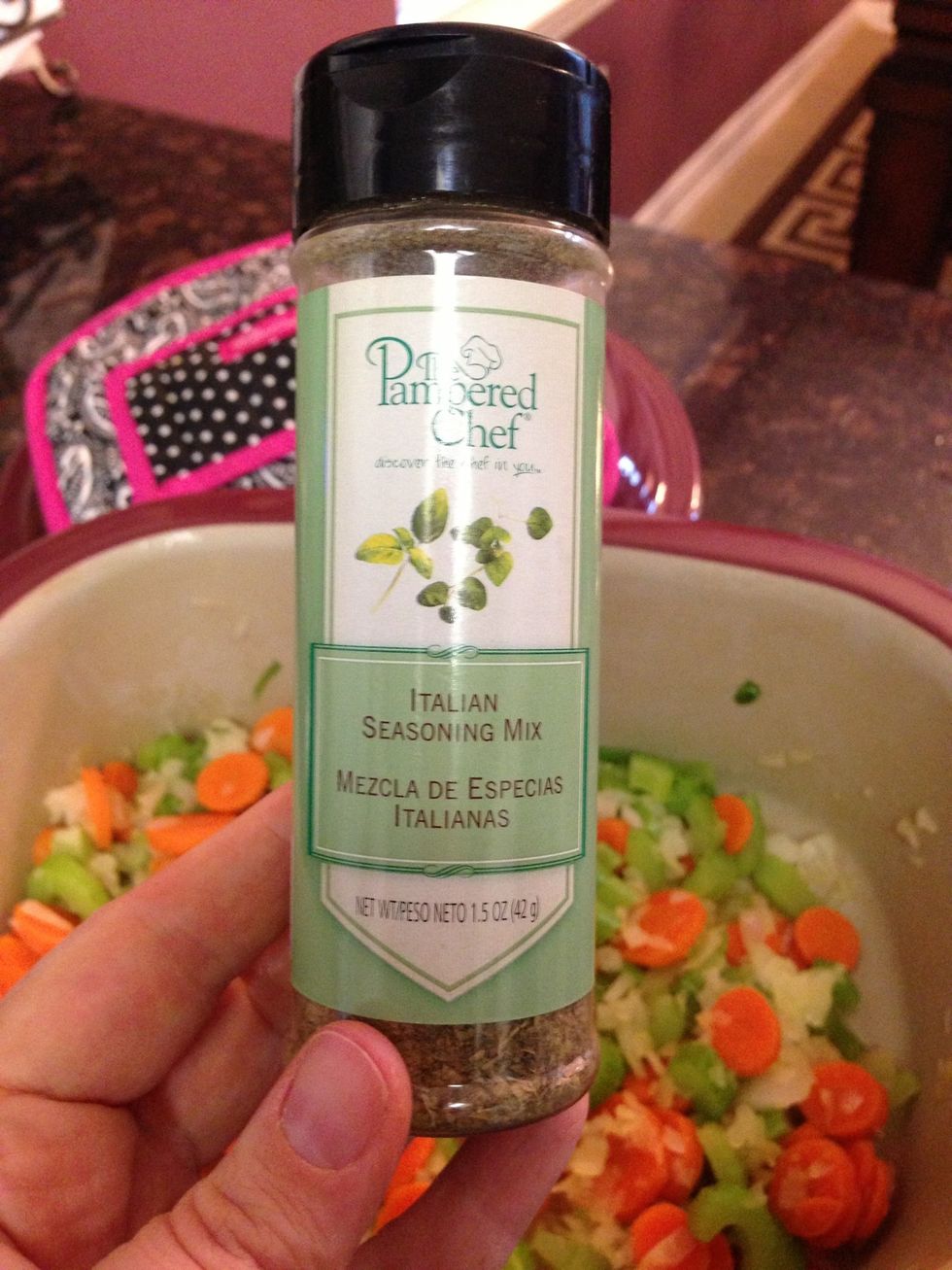 Time to add the seasonings. 1 Tbsp Italian Seasoning. I love our Pampered Chef seasonings. Now add Salt & Pepper to taste as well.