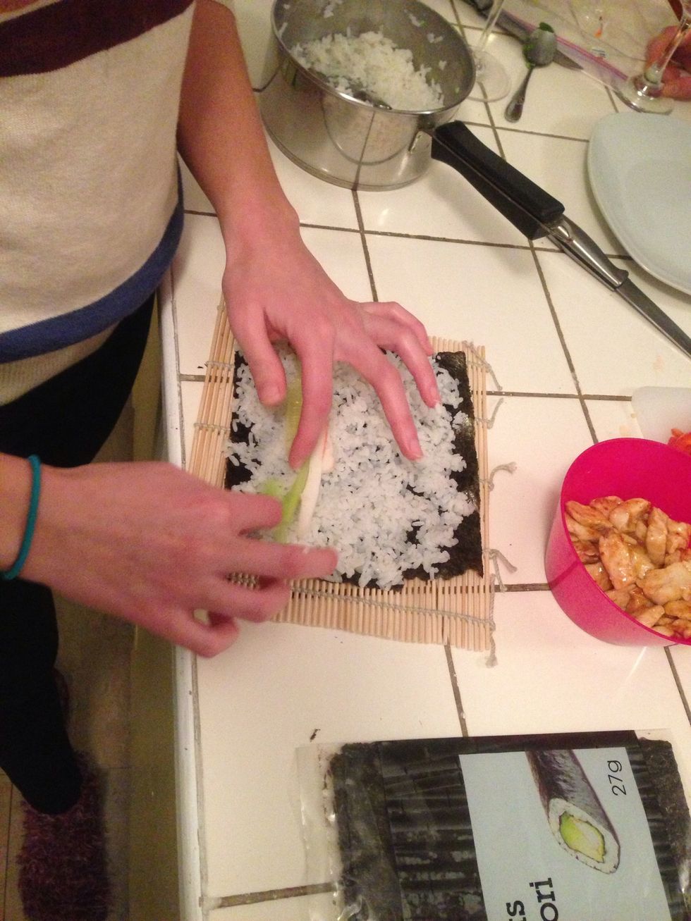 Time to arrange the veggies! As you can see we also stuffed with crab and chicken. I only used chicken, sushi doesn't have to be fishy! Place it horizontally across the seaweed about 1/4 of the way up