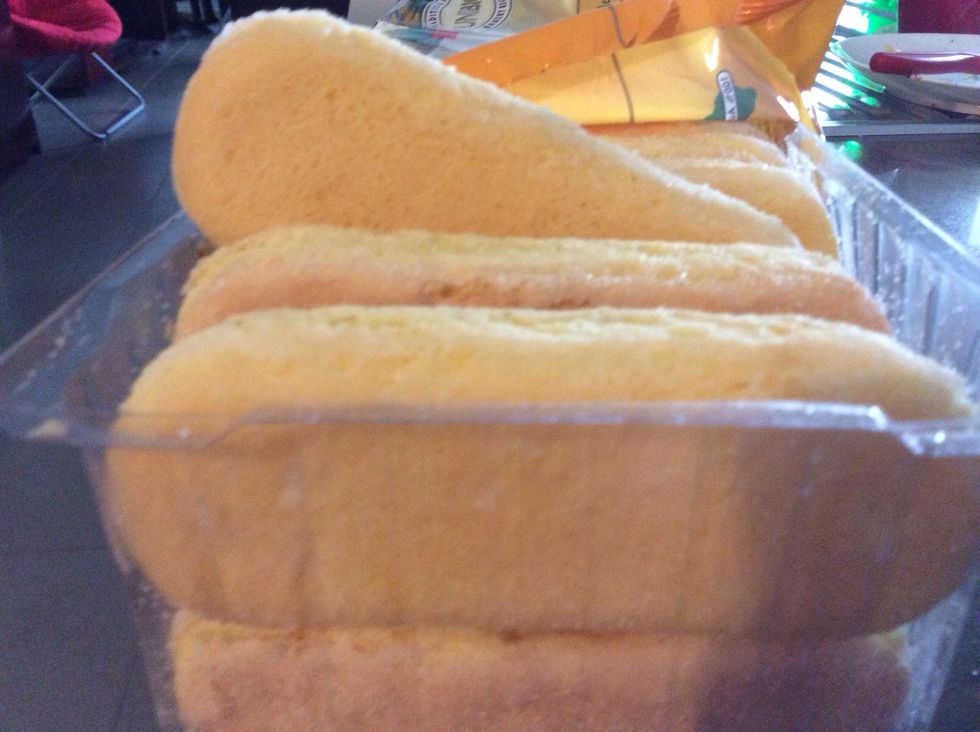 Time to construct! Place one sponge slice onto the tray and put cream, strawberries and the sauce onto it! Doesn't matter what order! Then to finish out another one on top and make it look nice!