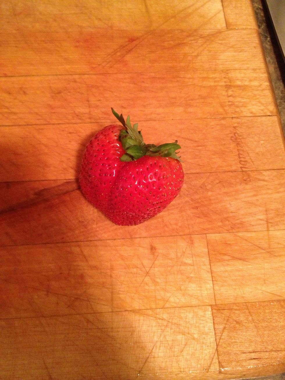 Time to cut up those strawberries. Make sure you wash them! Cut the top off.