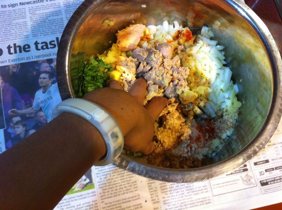 Time to get your hands dirty. Mash it all up real nice.