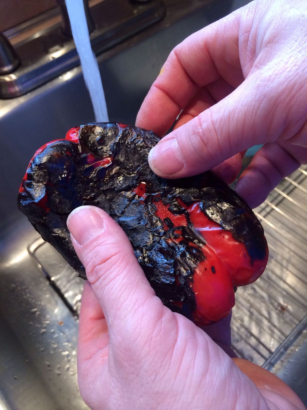 Time to remove the skins. Do this over a sink with the cold water running. This also helps with removing the skins.